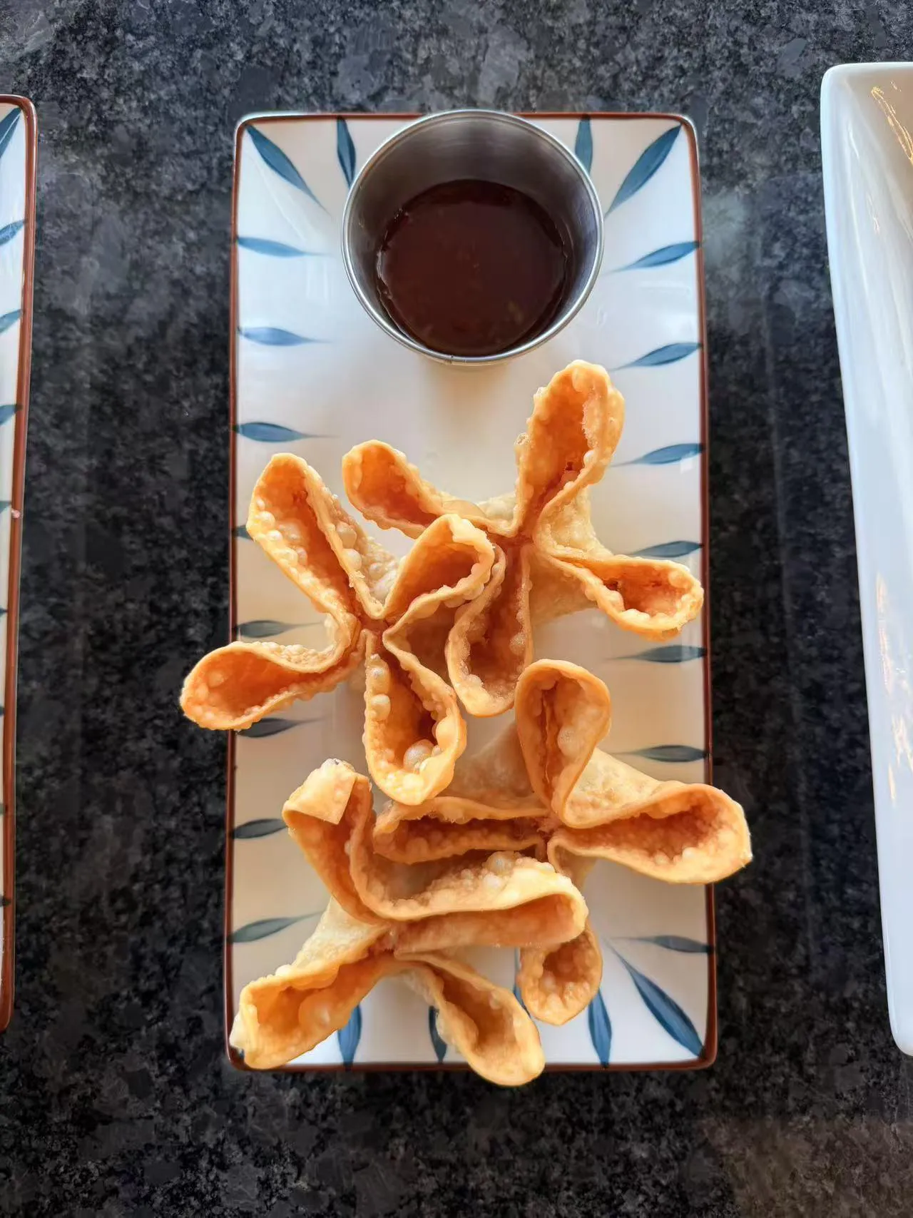 Crispy crab rangoons with sweet and sour sauce at Bobo Noodles And Dumplings, a Chinese Restaurant in Omaha